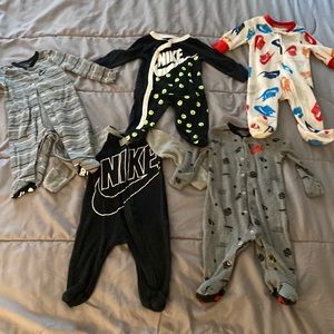 Five Nike onesies for a baby boy. All three months size. Gently used like new.